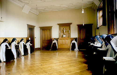 Discalced Carmelite nuns reading their bibles, Thicket Priory, Thorganby, North Yorkshire, England