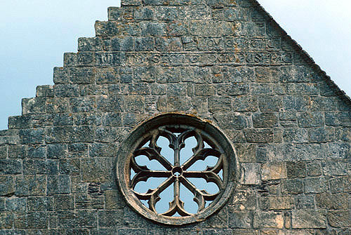 Valle Crucis Abbey, Cistercian abbey founded 1201, dissolved 1537, west gable of church with rose window and latin inscription, Llantysilio, Denbighshire, Wales