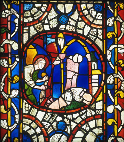 Lincoln Cathedral east window of the north aisle,  a beheaded corpse, 13th century stained glass