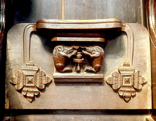 Misericord of two boars at a table,  Great Malvern Priory, Worcestershire