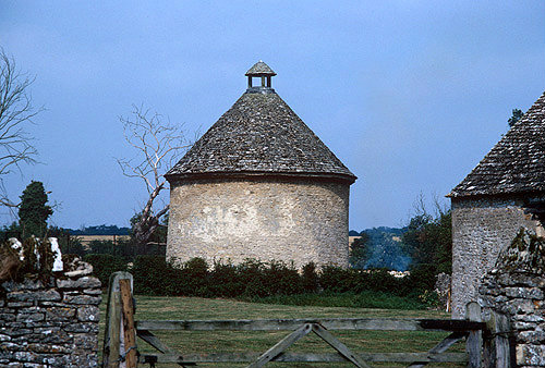 Old stone dovecot, or dovecote, originally used for keeping pigeons for meat, Minster Lovell, Oxfordshire, England