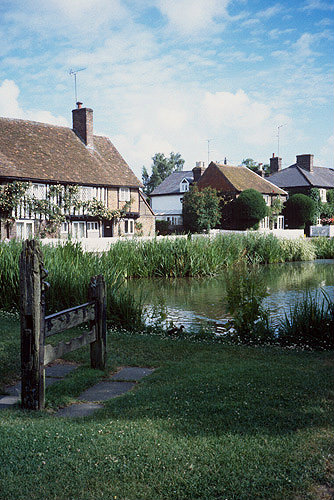 Village stocks in foreground, Albury Village, Hertfordshire, England