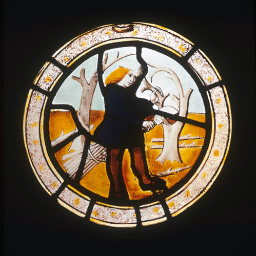 Labours of the months, pruning trees, prossibly March, from Brandiston Hall Norfolk 16th century stained glass by the Norwich School now in the Norwich Castle Museum and Art Gallery