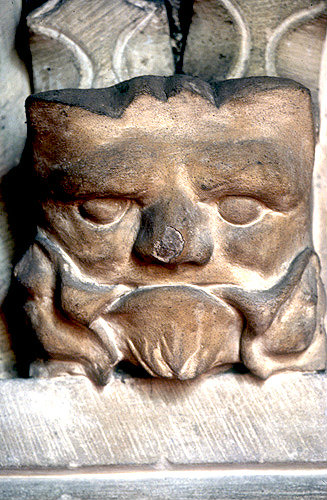 Green Man, carved in stone on column, Leckhampstead Church, Buckinghamshire, England