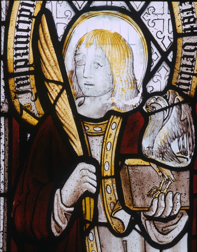 St John one of the four Evangelists depicted in one of the south aisle windows St Neot Church Cornwall