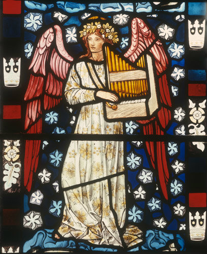 Angel playing portable organ, designed by Edward Burne-Jones, 1882, Church of St Peter and St Paul, Cattistock, Dorset, England