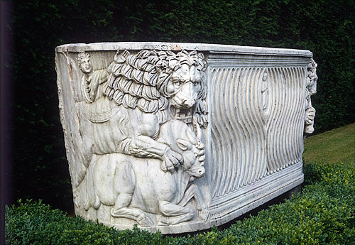 Fluted Roman sarcophagus, circa 200-250, with lion accompanied by keeper tearing humped cow to pieces, bought in Rome, Cliveden House, Buckinghamshire, England