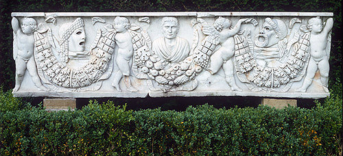 Putti carrying garlands, comic and tragic masks, male portrait between, marble Roman sarcophagus, circa 100, bought n Rome, Cliveden House, Buckinghamshire, England