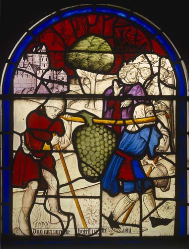 Joshua and Caleb, the two spies returning from the promised land of Canaan bearing grapes, 16th century stained glass, Church of St Leonard, Marston Bigot, Somerset, England, Great Britain