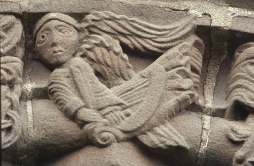Angel over south door 12th century  Church of  of Saints Mary and David Kilpeck Herefordshire