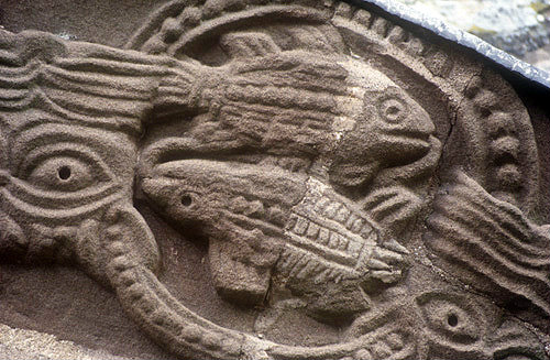 Fishes carved over the south door of twelfth century Kilpeck Church of St Mary and David, Herefordshire
