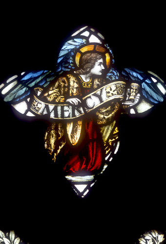 Mercy, by Powell, nineteenth century, tracery of window 3, south nave aisle, Exeter Cathedral, England