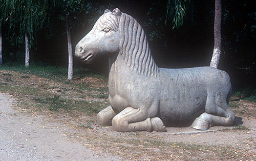 Kneeling horse on Sacred Way leading to Ming Tombs, China