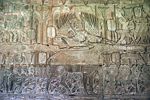Carved relief of judgement of Yama who sits with multiple arms on buffalo and points to road leading to heaven and hell, Angkor Wat temple, Cambodia