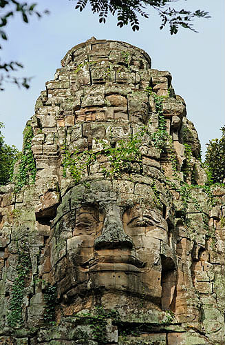 One of four carved faces on gopura, west gate, Angkor Thom, completed late twelfth century by King Jayavarman VII, Cambodia