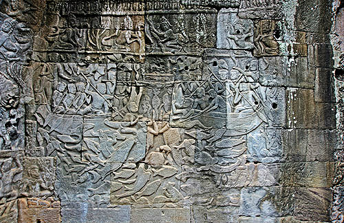 Relief carving of two boats surrounded by fish, apsanas above, second enclosure wall, Bayon temple, Angkor Thom, Cambodia
