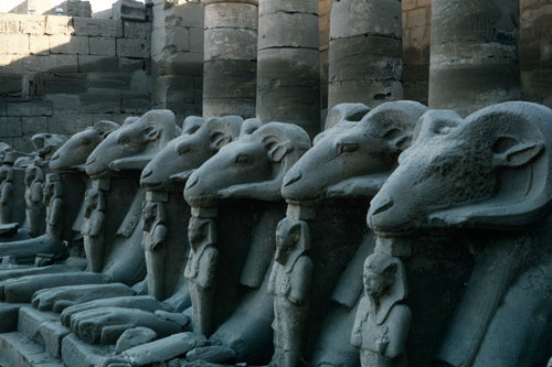Egypt, Karnak, rams in the first court of the Temple, with statues of Ramesses II between their feet