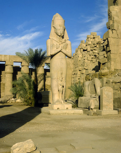Egypt, Karnak, the temple of Amun, colossal statue of Ramesses II with his consort, Nefertari, between his knees