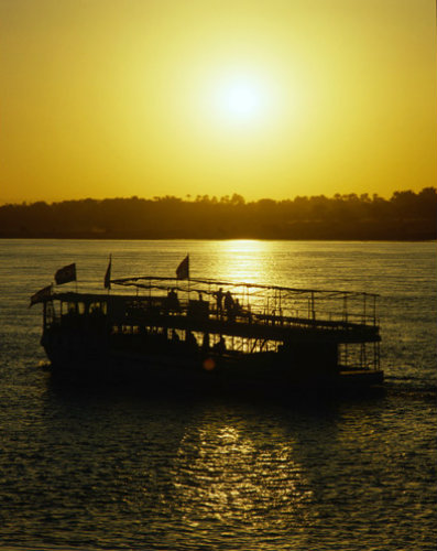 Egypt Luxor ferry on the Nile at sunset