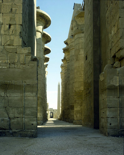 Egypt, Karnak, Temple of Amun, view from second pylon through the hypostyle hall to the granite obelisk erected by Thutmose I