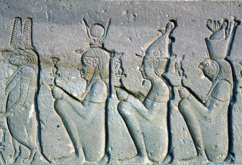 Sunk relief sculpture of figures including Sobek, Isis and Hathor on the western facade of the Temple of Hathor, Dandara, Egypt
