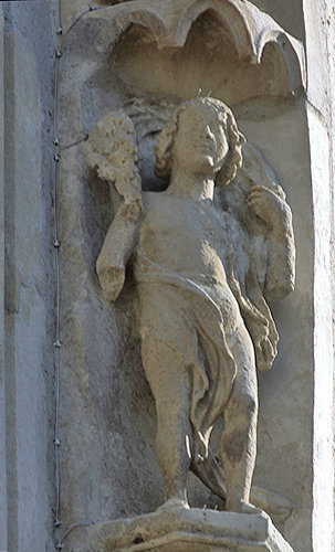 Chartres Cathedral, north porch, right bay, first archivolt, summer, naked figure, 13th century