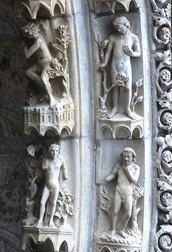 Chartres Cathedral, north porch, centre bay, outer arch, Adam asleep and in the garden of Eden, Eve under a tree and Adam standing by, 13th century architectural sculpture