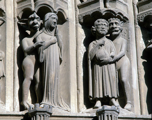 Chartres Cathedral, South Porch, central bay, right archivolts, demon and nun, demon and miser