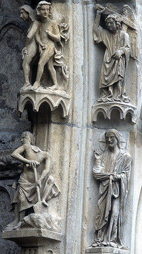France, Chartres Cathedral, north porch, centre bay, outer arch, Adam and Eve, 13th century architectural sculpture
