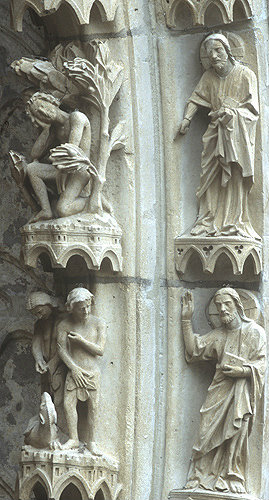 France, Chartres Cathedral, north porch, centre bay, outer arch, Adam and Eve, 13th century architectural sculpture