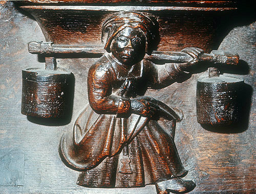 Misericord of milkmaid, fifteenth century, Church of La Trinite, Vendome, France