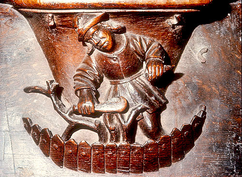 Misericord of  labour of month of March, pruning the vines, fifteenth century,  Church of La Trinite, Vendome, France