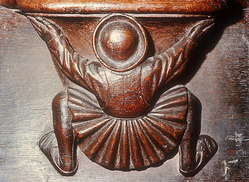 Misericord of back view of man supporting misericord, fifteenth century, Church of La Trinite, Vendome, France