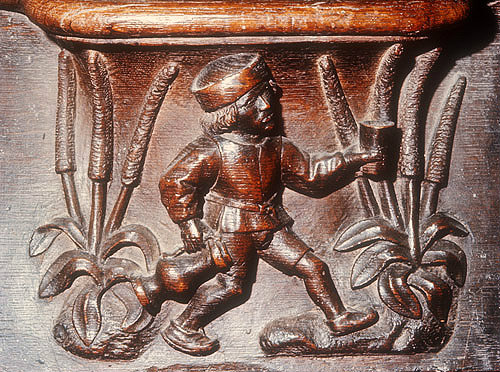 Misericord of labour of month of July, refreshments being brought out to field workers, fifteenth century misericord, Church of La Trinite, Vendome, France