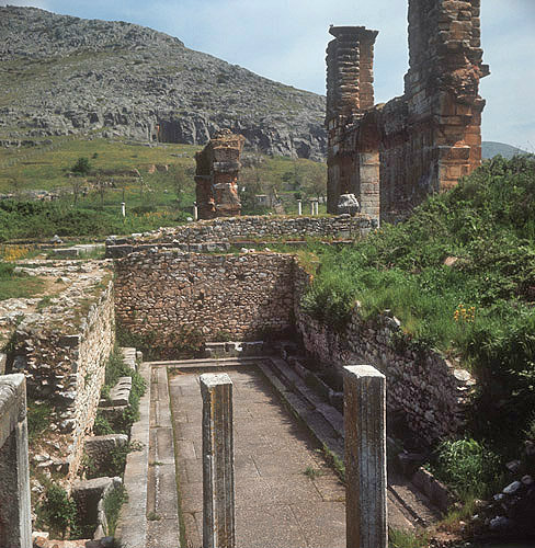 Latrines, with sixth century Basilica and Acropolis in the background, Philippi, Greece