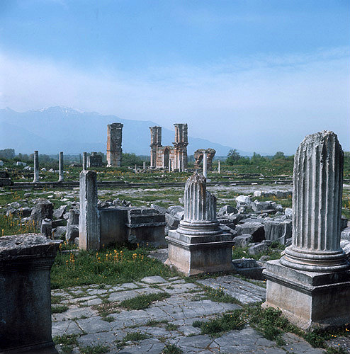 Part of east Temple, forum, agora and Direkler Basilica beyond. Philippi, Greece