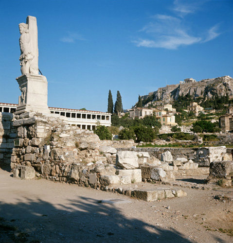 Greece Athens the Athenian Agora, the Stoa of Attalus on the left, the Acropolis on the right and one of the Tritons in the foreground