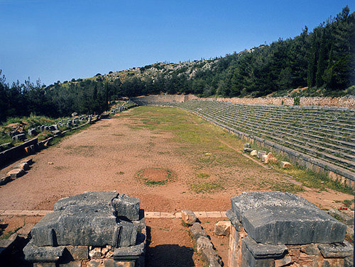 Stadium, fifth century BC, entrance pillars and starting ground beyond, Delphi, Greece