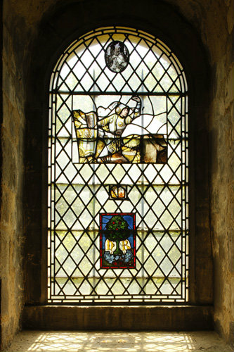 Stained glass panels in window in the Chapel of St John the Evangelist, White Tower, Tower of London, photo Historic Royal Palaces