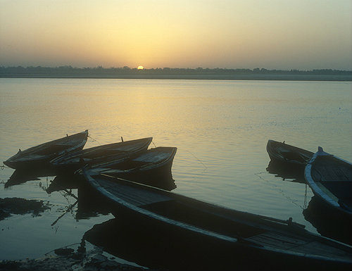 Sunrise on the Ganges, with boats, Benares, India