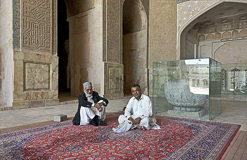 Masjed-e Jameh, Seljuk, oldest mosque in Iran, two men in north iwan, Isfahan, Iran