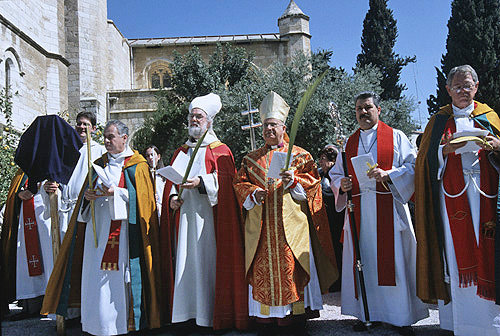 Israel, Jerusalem, Rowan Williams, the former Archbishop of Canterbury with the clergy on Palm Sunday outside St George