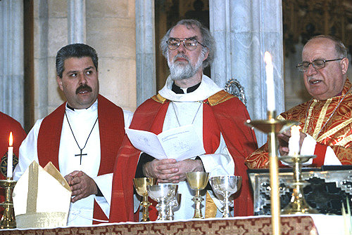 Israel, Jerusalem, Rowan Williams, the former Archbishop of Canterbury taking Communion on Palm Sunday in St George