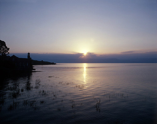 Israel, Sea of Galilee at dawn, St Peters Church on the shores at Tabgha