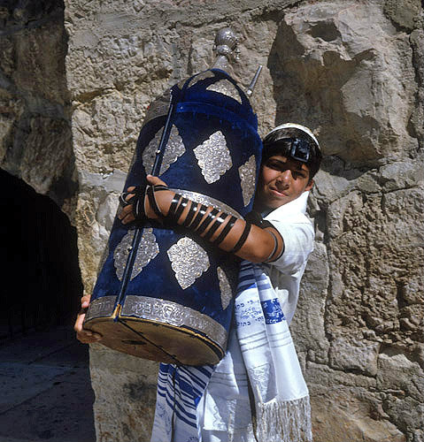 Israel, Jerusalem, a Jewish boy holding the Torah at his bar mitzvah