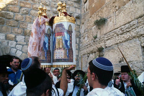 Israel Jerusalem Religious Jews pray around a Torah scroll at the Western Wall during the festival of Sukkot