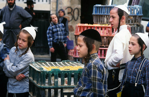 Israel Jerusalem religious Jewish children in Mea Shearim neighbourhood watch the Kaparot ritual