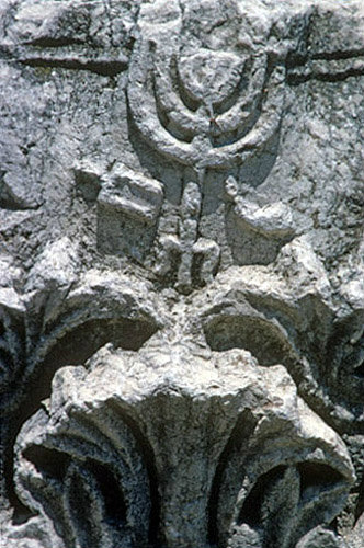 Capital from synagogue, with relief of menorah, shofar and incense shovel, Capernaum, Israel