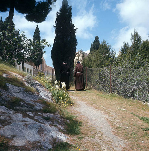 Israel, Bethphage,  two monks in the garden of the Franciscan Church