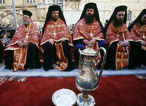 Israel, Jerusalem, Greek Orthodox priests outside the Holy Sepulchre Church for feet washing on Maundy Thursday